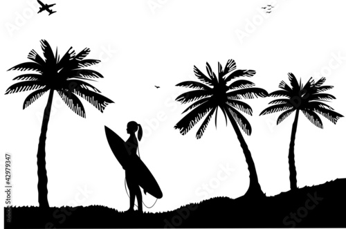 Beautiful young surfer girl standing on the beach silhouette