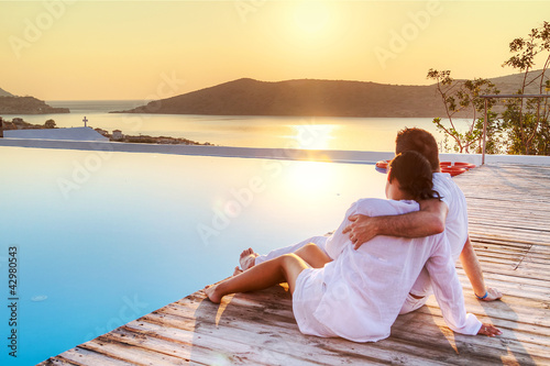 Couple in hug watching sunrise together © Patryk Kosmider