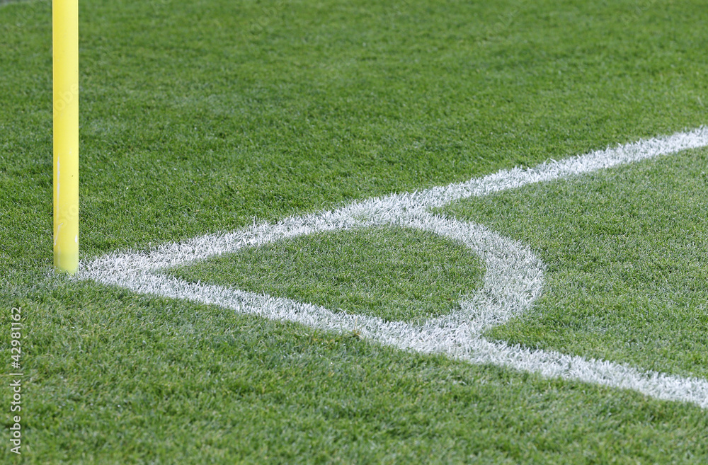 Close-up view of corner kick of the green soccer field Close-up view of corner kick of the green soccer field