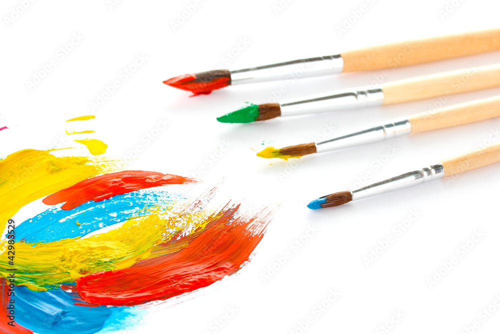 Fototapeta premium Abstract gouache paint and brushes, isolated on white