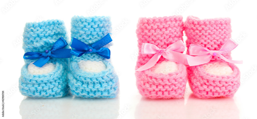 pink and blue baby boots isolated on white