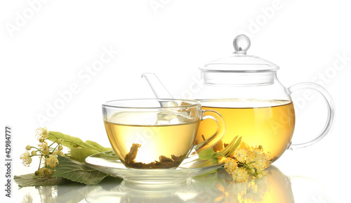 cup and teapot of linden tea and flowers isolated on white