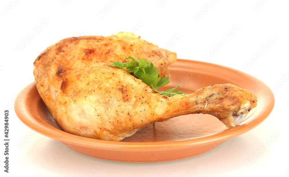 roasted chicken leg with parsley in the plate isolated on white roasted chicken leg with parsley in the plate isolated on white