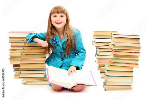 little girl with a books is...