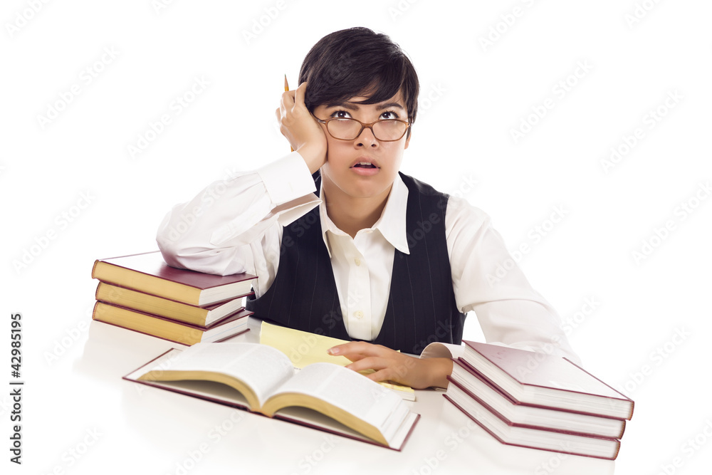 Bored Mixed Race Female Student at Desk with Books Bored Mixed Race Female Student at Desk with Books