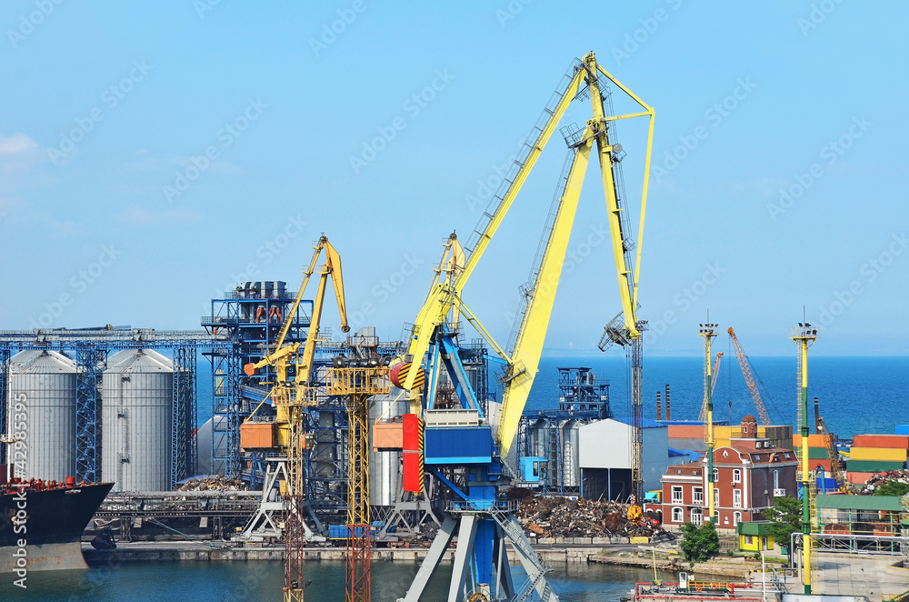 Cargo crane, ship and grain dryer in port Odessa, Ukraine