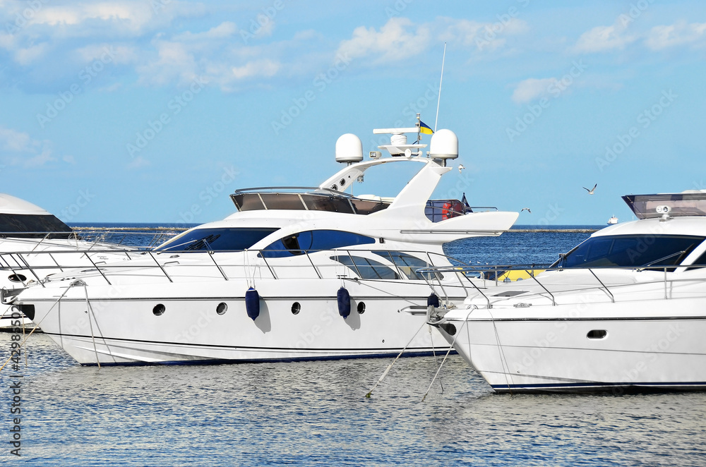 Fototapeta premium White motor yacht over harbor pier, Odessa, Ukraine