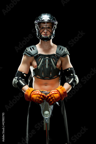 Boys lacrosse player isolated on a black background
