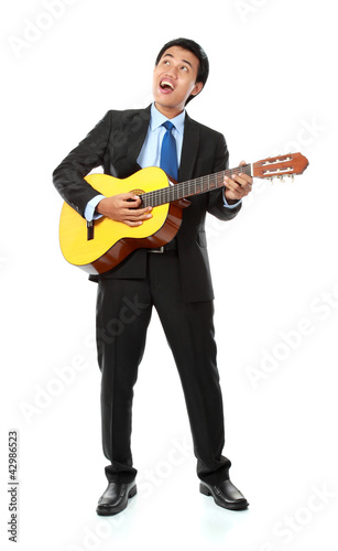 Businessman playing guitar