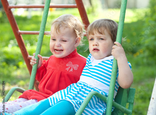 two children on  swings © JackF