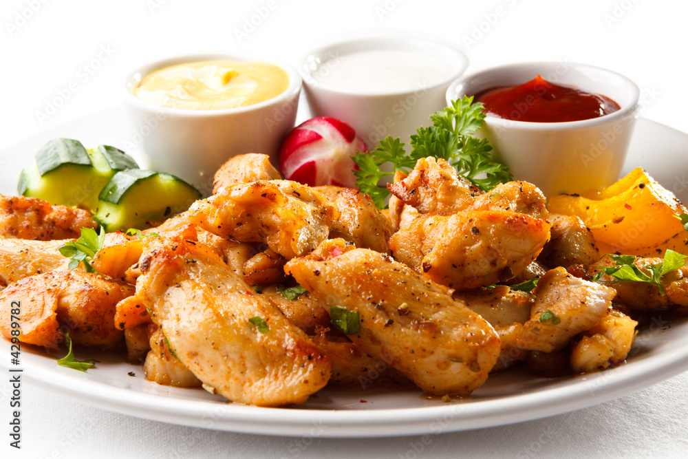 Grilled meat and vegetables on white background Grilled meat and vegetables on white background