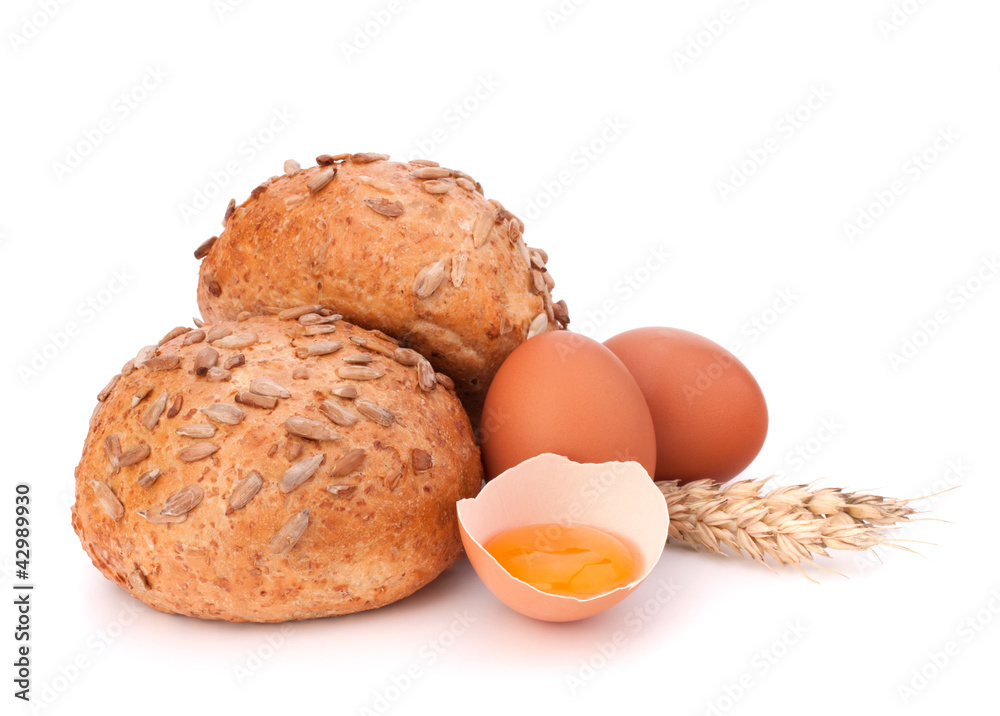 Bun with seeds and broken egg Bun with seeds and broken egg