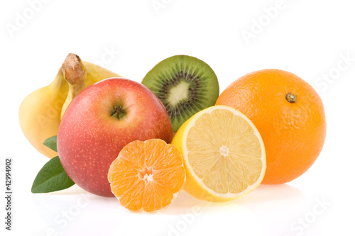 fresh tropical fruits and slices isolated on white