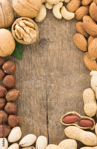 set of nuts fruit on wood background