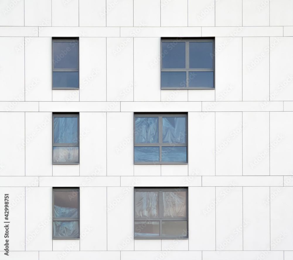 Windows in White Wall Under Construction Windows in White Wall Under Construction