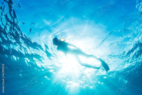 Woman Snorkeling in Tropical Ocean photo