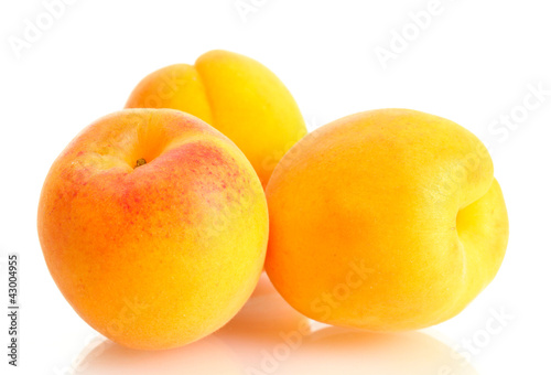 ripe sweet apricots isolated on white