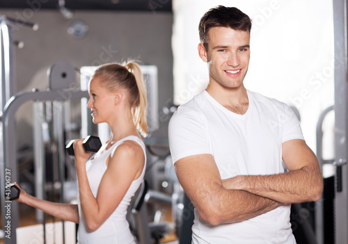 Couple exercising at gym