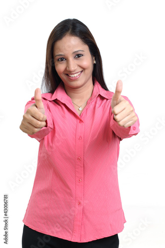 Business woman showing thumbs up