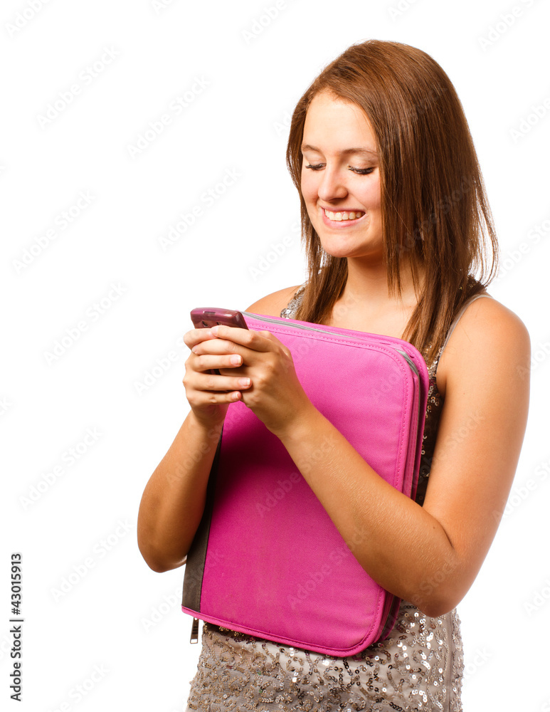 Happy teenage schoolgirl smiling and texting with cell phone Happy teenage schoolgirl smiling and texting with cell phone