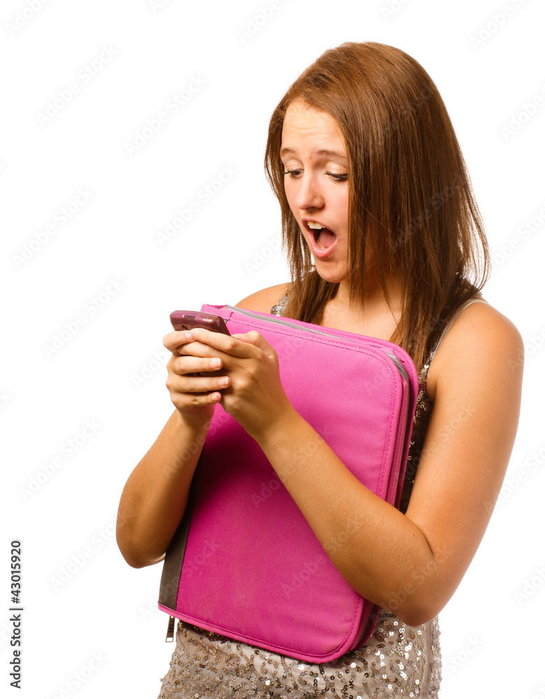 Texting teen schoolgirl reacts with shock and surprise Texting teen schoolgirl reacts with shock and surprise