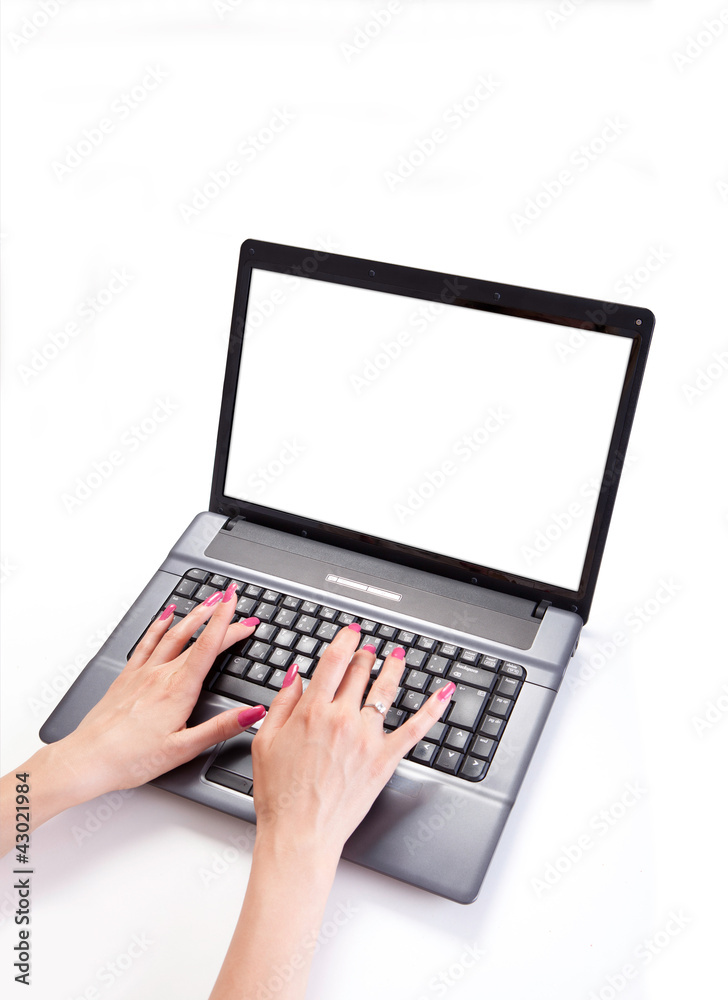 female hands typing on the keyboard of a laptop female hands typing on the keyboard of a laptop