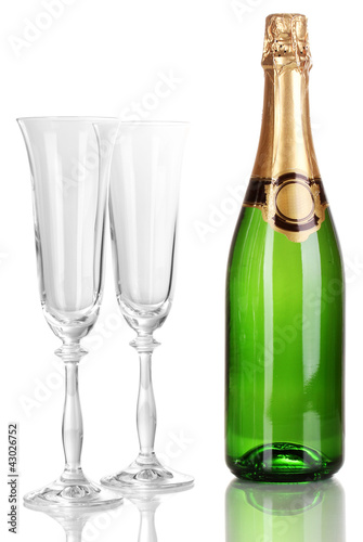 Bottle of champagne and goblets isolated on white