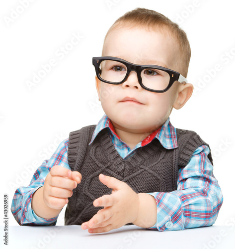 Portrait of a cute little boy wearing glasses