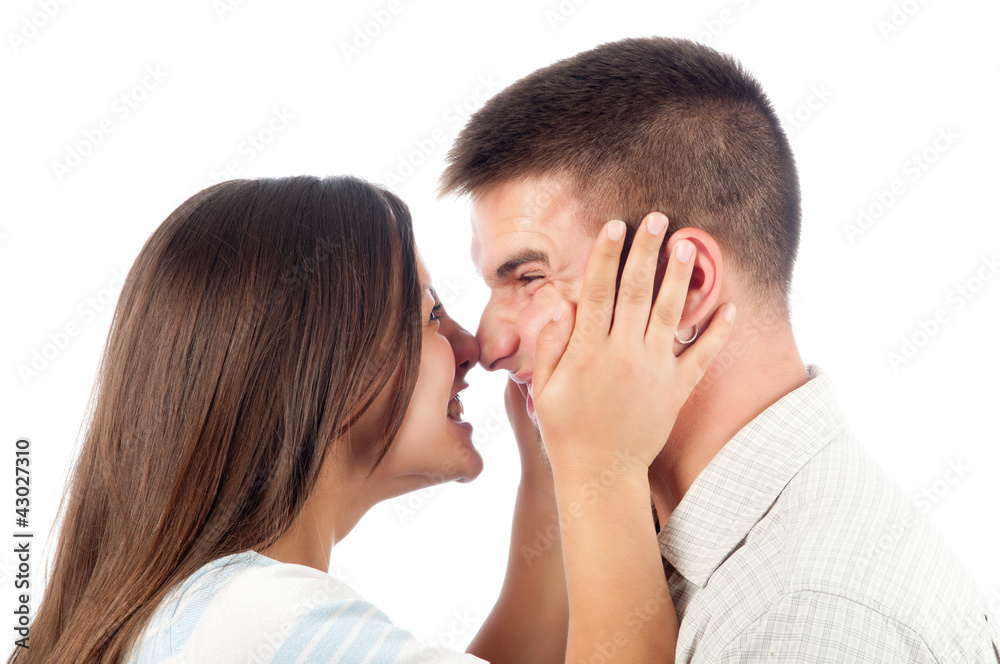 Young couple in love having fun isolated on white Young couple in love having fun isolated on white