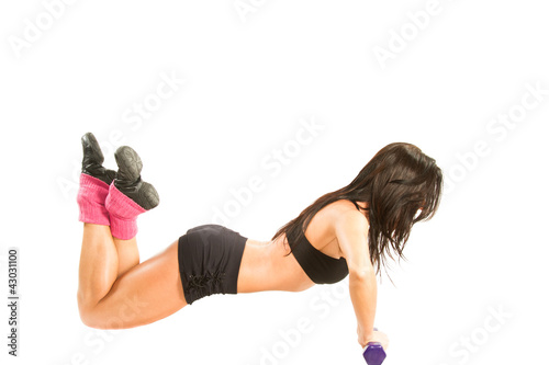 woman in sports bra does exercise with dumbbells