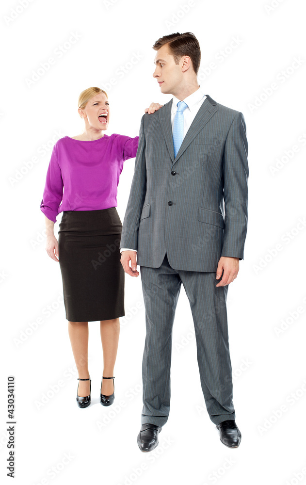 Female secretary shouting on her co-worker Female secretary shouting on her co-worker