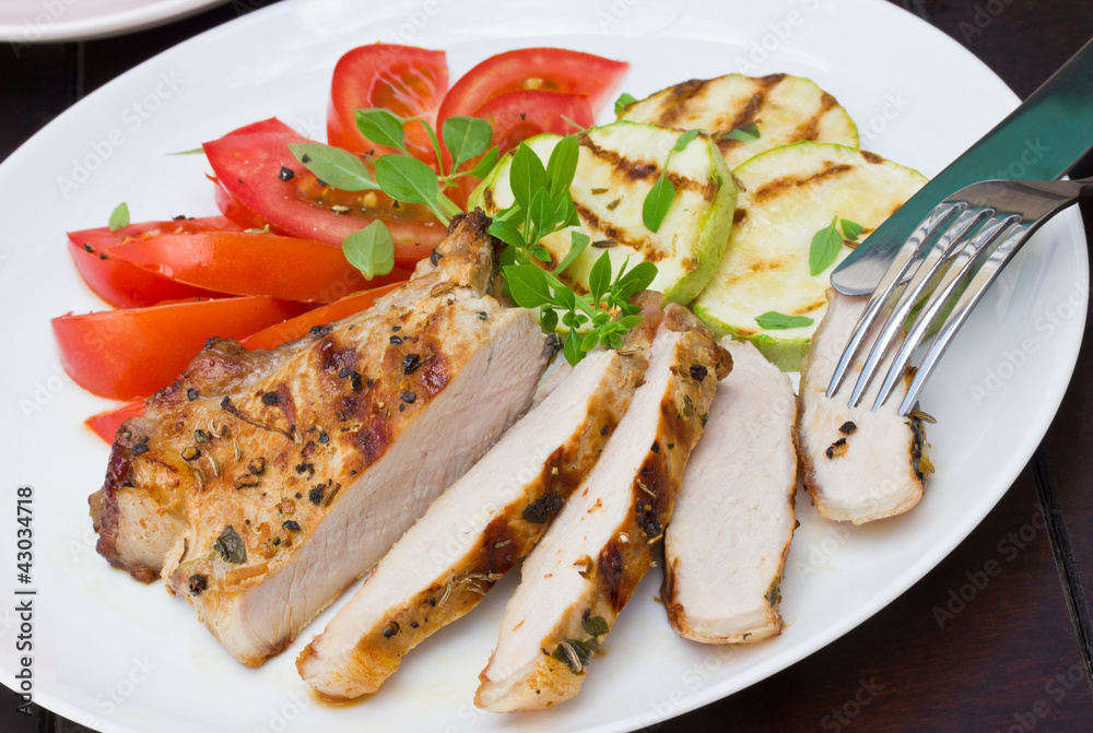 Sliced grilled steak and delicious vegetables for garnish Sliced grilled steak and delicious vegetables for garnish