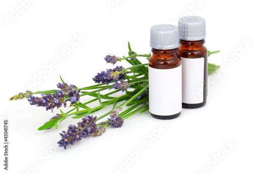 Aromatherapy Lavender oil and lavender flower, isolated on white