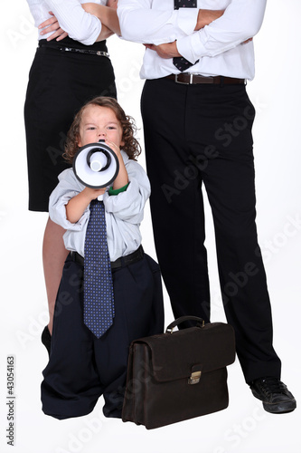 little boy protesting against business people photo