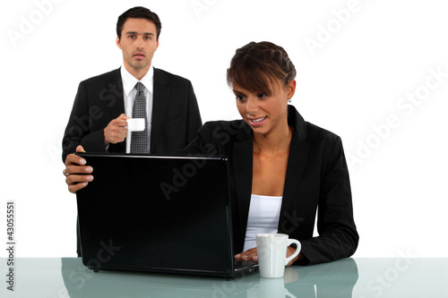 Employees having a coffee in office