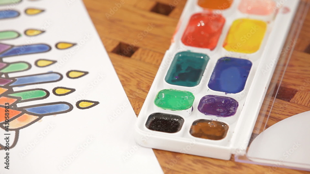 Children drawing candles with watercolors Children drawing candles with watercolors