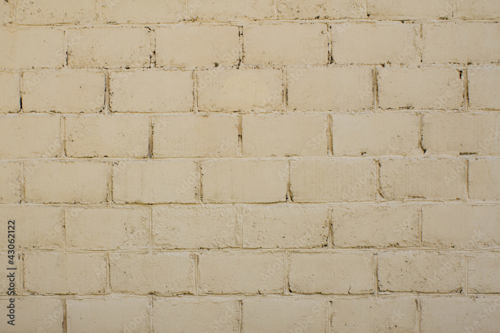 Fototapeta premium Beige brick wall - use as background