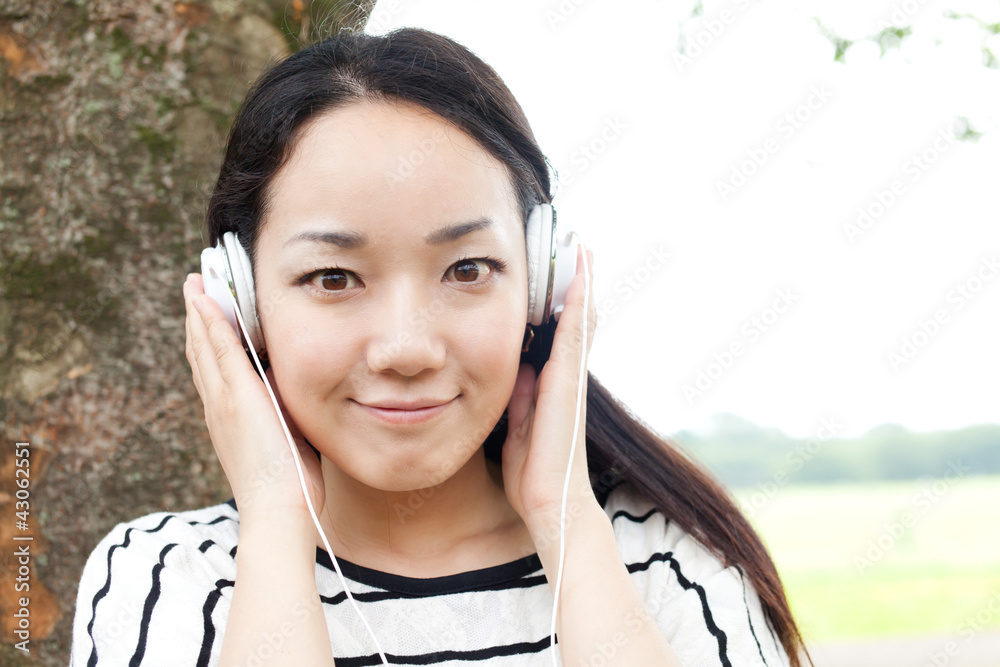 Beautiful young woman in the park. Portrait of asian. Beautiful young woman in the park. Portrait of asian.