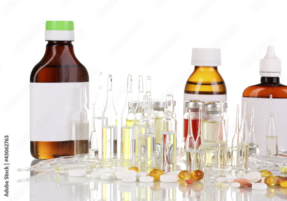 Medical bottles with medical ampoules and tablets isolated Medical bottles with medical ampoules and tablets isolated