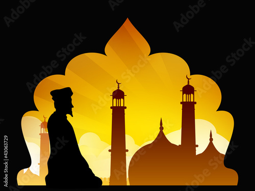 Silhouette of a Muslim man reading Namaz in Mosque or Masjid. EP