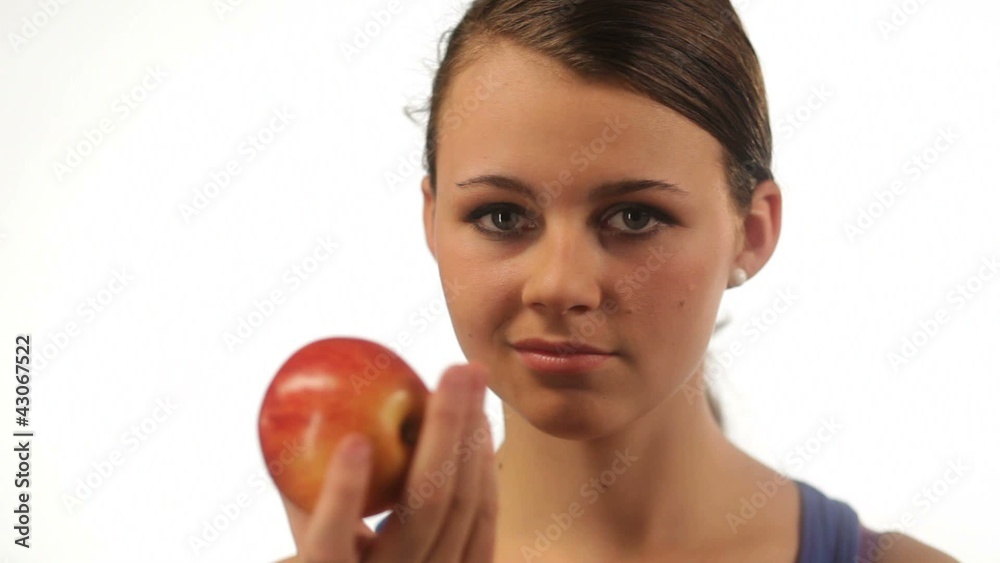 Pretty girl eating an apple isolated Pretty girl eating an apple isolated