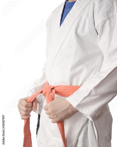 White kimono and an orange belt.