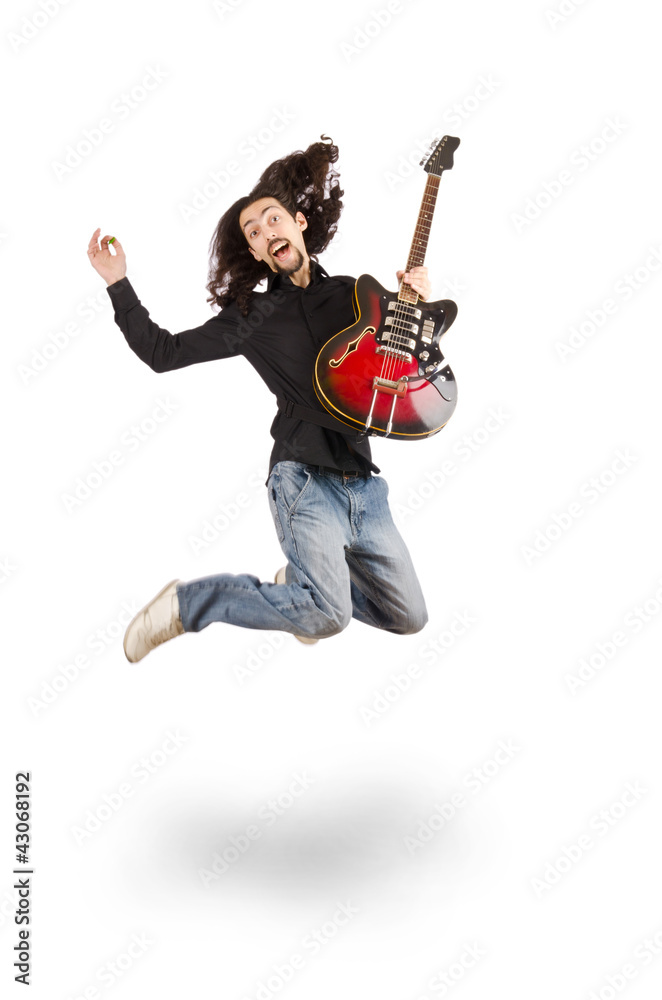 Young man playing guitar on white
