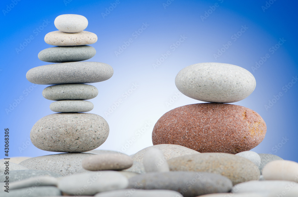 Pebbles stack against gradient background Pebbles stack against gradient background