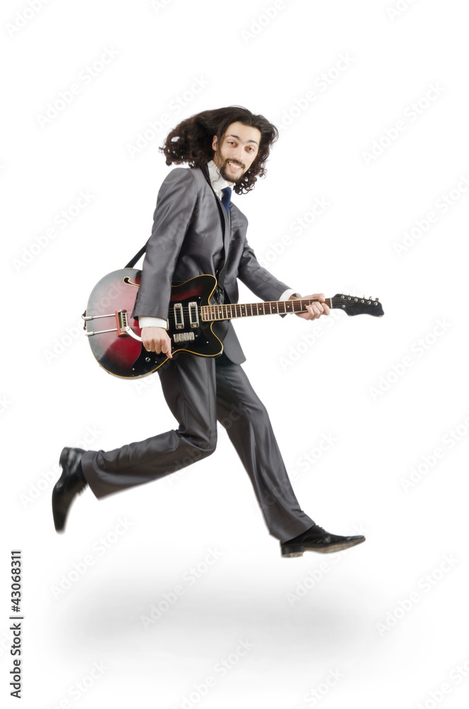 Guitar player in business suit on white Guitar player in business suit on white