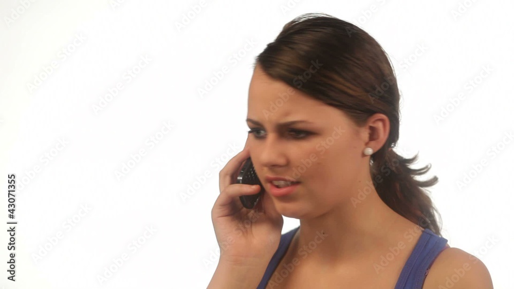 Young woman nervous talking on the phone isolated Young woman nervous talking on the phone isolated