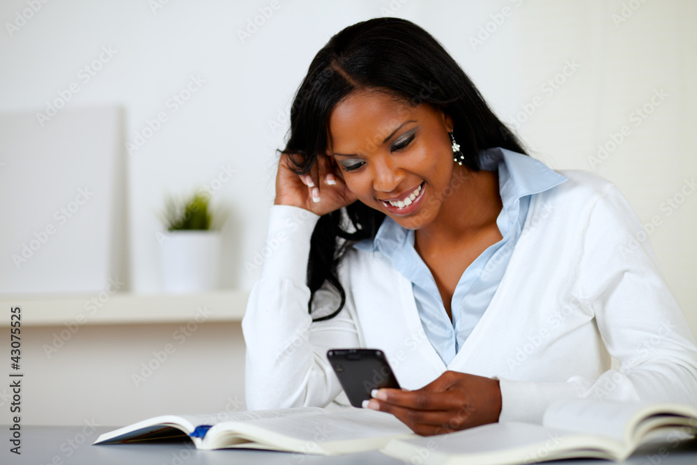 Prettty lovely woman smiling with cellphone Prettty lovely woman smiling with cellphone
