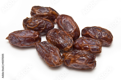 Medjool dates isolated on a white studio background.