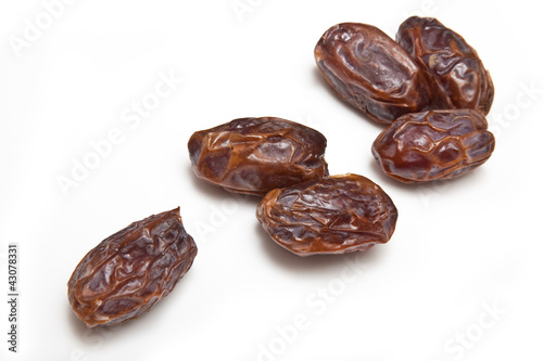 Medjool dates isolated on a white studio background.