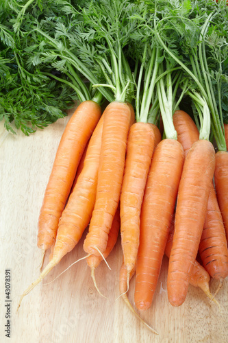 Fresh carrots on cutting board